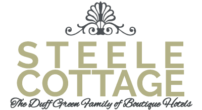 Logo of Steele Cottage, featuring elegant typography and ornate design elements.